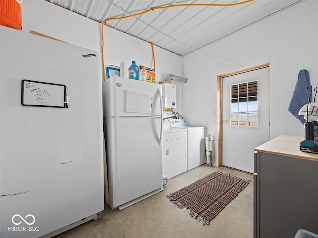 laundry room with washing machine and dryer and water heater