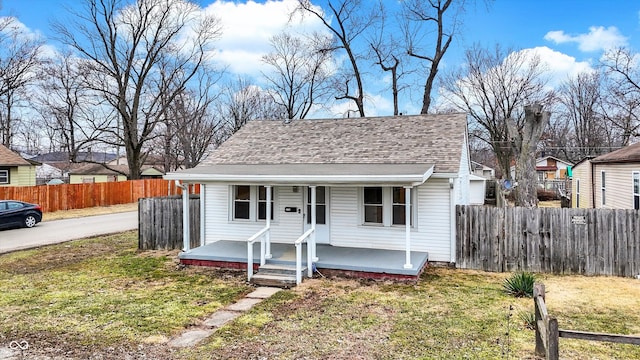 bungalow-style house with a front yard and a porch