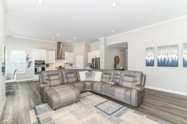 living room with recessed lighting, baseboards, wood finished floors, and ornamental molding