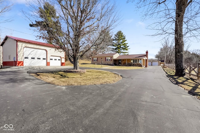 single story home featuring a garage