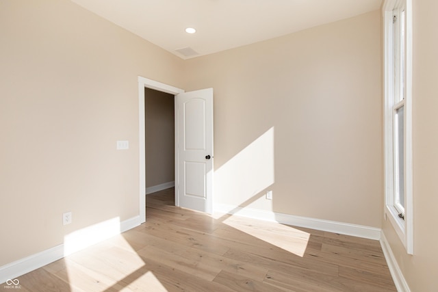 empty room with light hardwood / wood-style floors