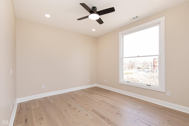 unfurnished room featuring ceiling fan and light wood-type flooring