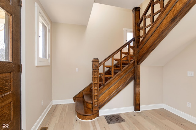 staircase featuring hardwood / wood-style floors