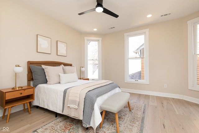 bedroom with ceiling fan and light wood-type flooring