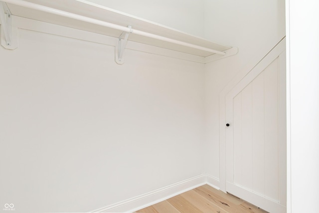 walk in closet featuring hardwood / wood-style flooring