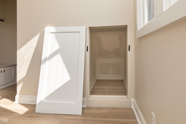 stairs with wood-type flooring