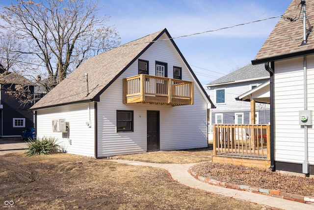 rear view of house with a balcony