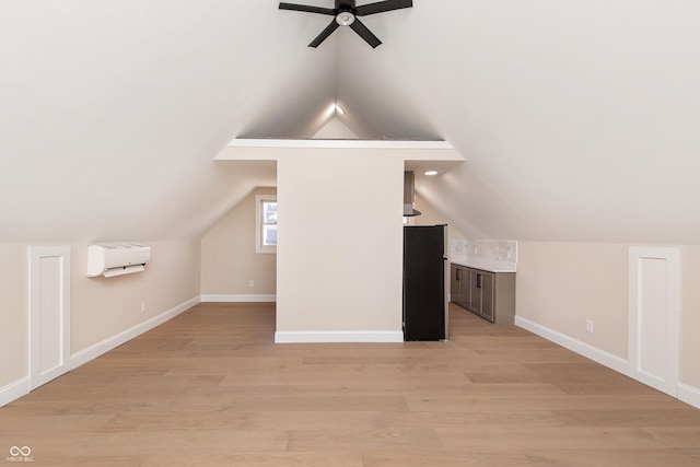 bonus room featuring lofted ceiling, light hardwood / wood-style floors, and ceiling fan