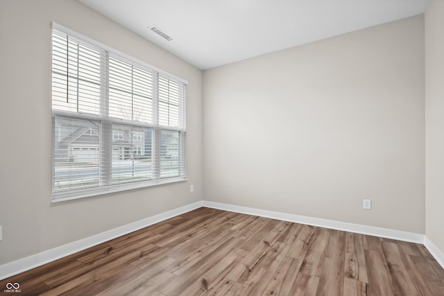 empty room with wood-type flooring