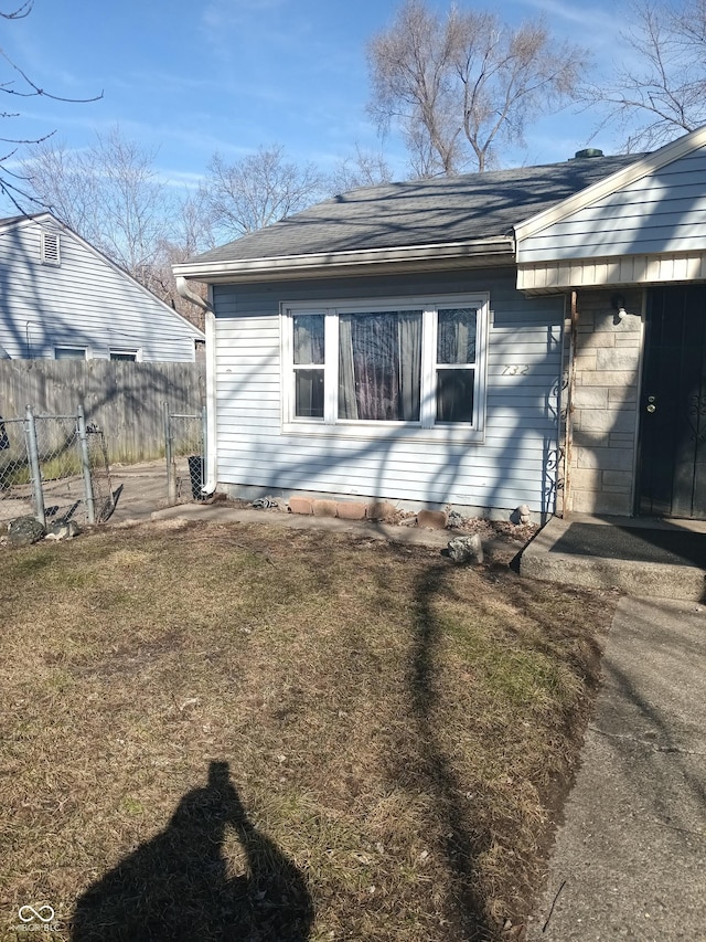 view of home's exterior with a yard