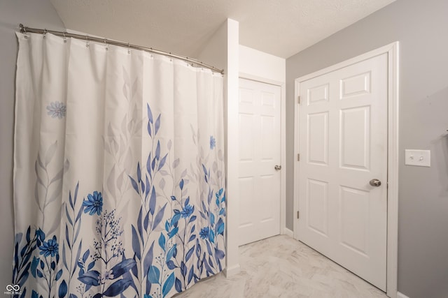 bathroom featuring a textured ceiling