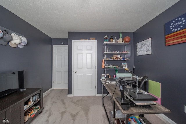 office area featuring light colored carpet and a textured ceiling