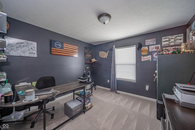 carpeted home office with a textured ceiling