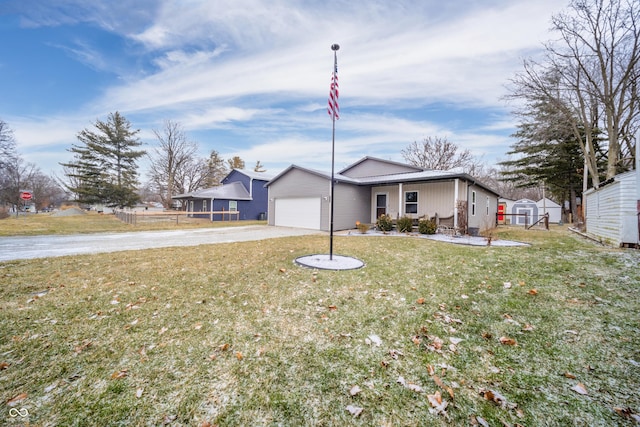 single story home featuring a garage, a shed, and a front lawn