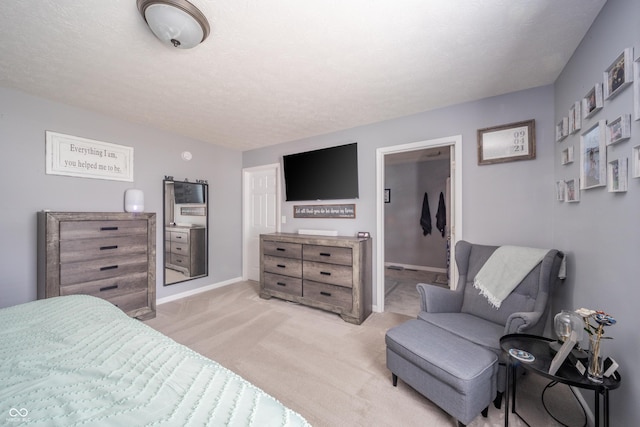 carpeted bedroom with a textured ceiling