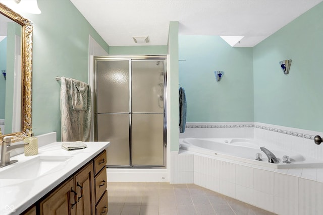 bathroom featuring tile patterned floors, vanity, and separate shower and tub