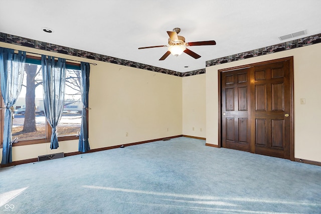 unfurnished bedroom featuring ceiling fan and carpet flooring