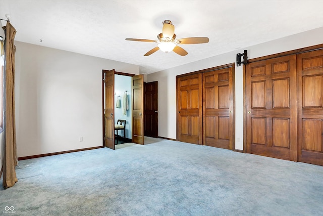 unfurnished bedroom featuring light carpet and ceiling fan