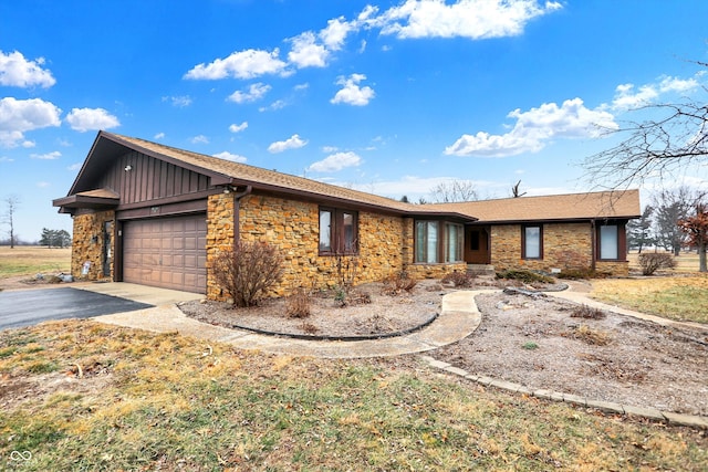 ranch-style house featuring a garage