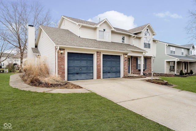 view of front of home with a front yard and a garage