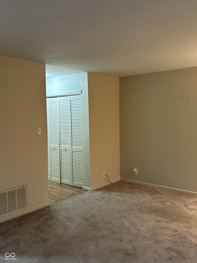 empty room with light colored carpet