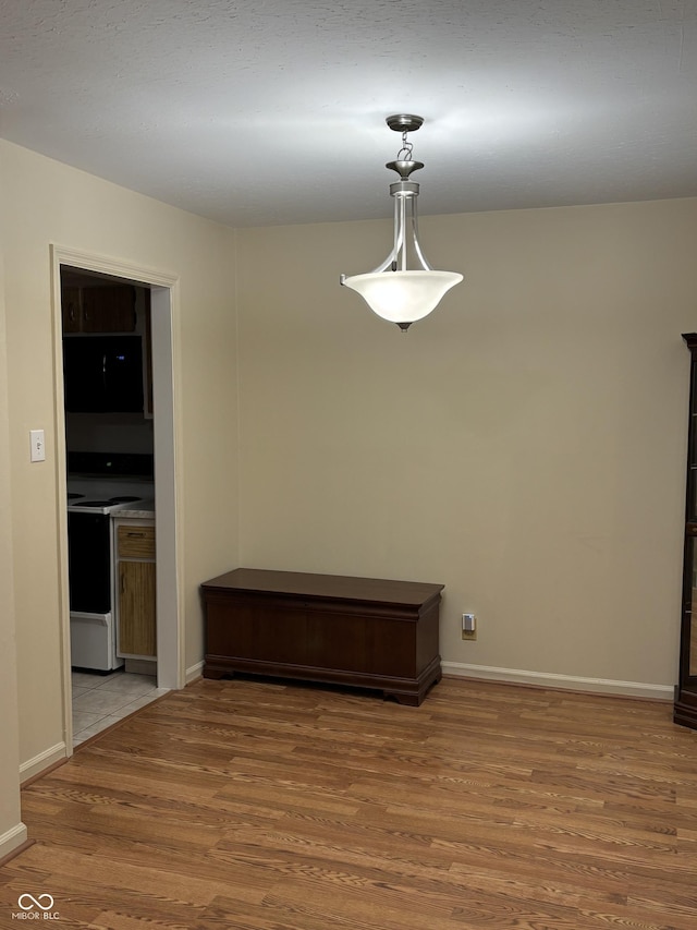 unfurnished dining area with hardwood / wood-style floors