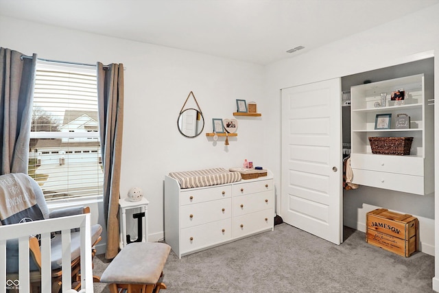 bedroom featuring light carpet