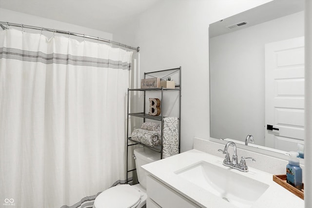 bathroom with vanity and toilet