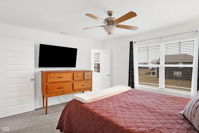 carpeted bedroom with ceiling fan