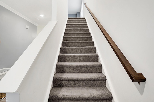 staircase with ornamental molding