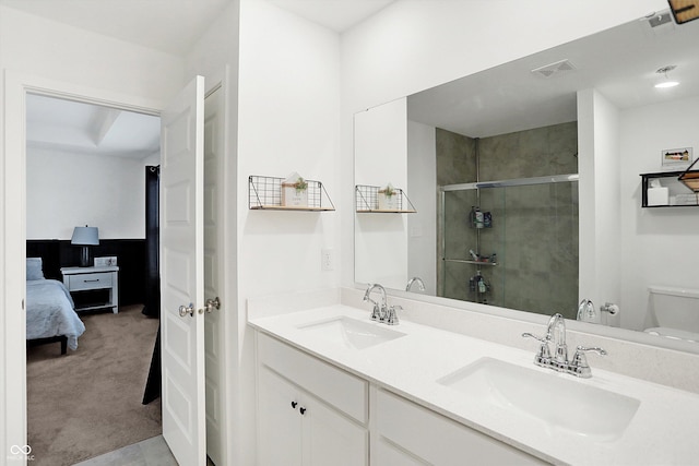 bathroom with vanity, toilet, and walk in shower