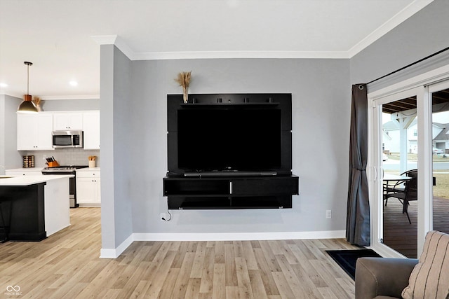 living room featuring ornamental molding and light wood-type flooring