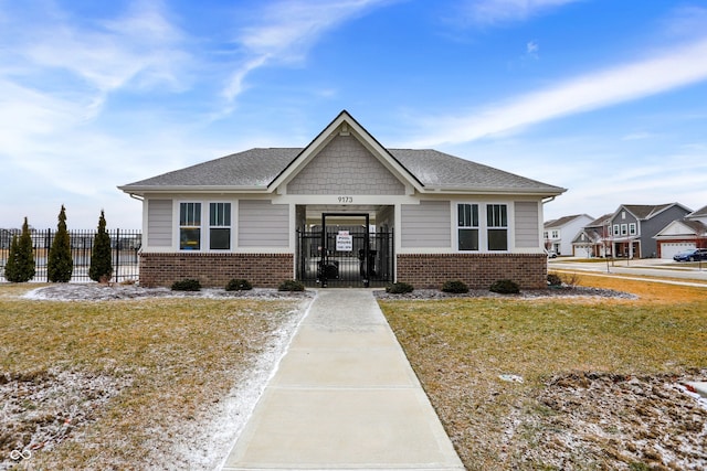 view of front of house featuring a front lawn