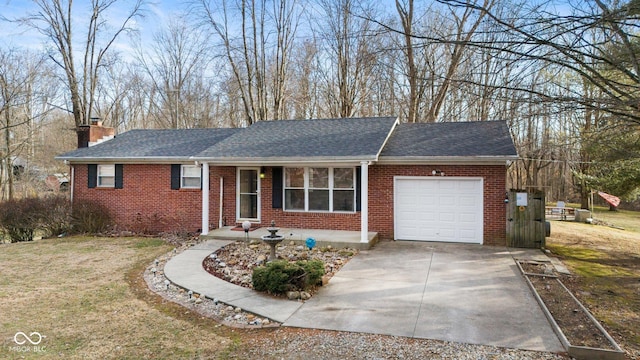 ranch-style home featuring a garage and a front yard