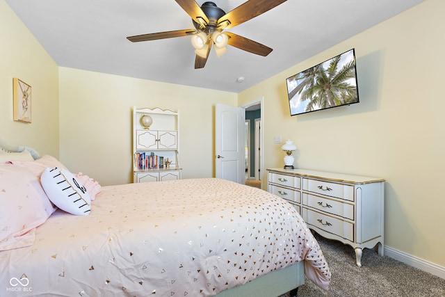 bedroom with ceiling fan, carpet flooring, and baseboards