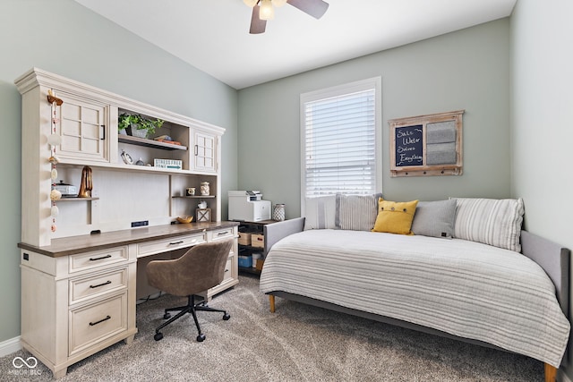 bedroom with light carpet and a ceiling fan