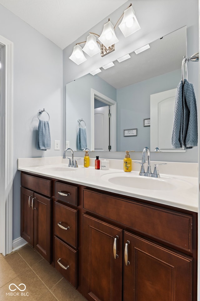 full bathroom featuring a sink and double vanity