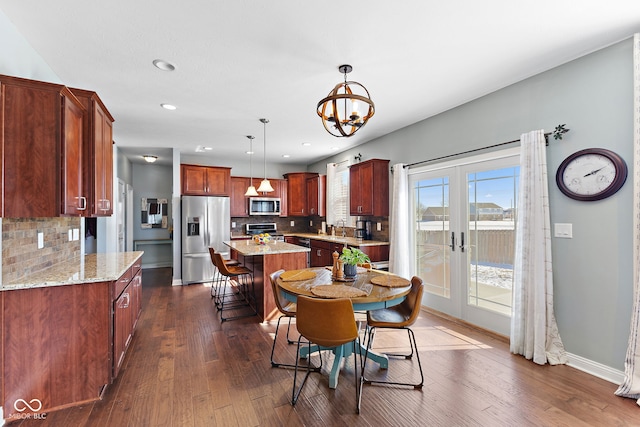 dining room with dark wood-style floors, recessed lighting, french doors, and baseboards