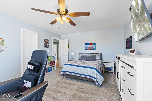 bedroom featuring dark colored carpet and a ceiling fan