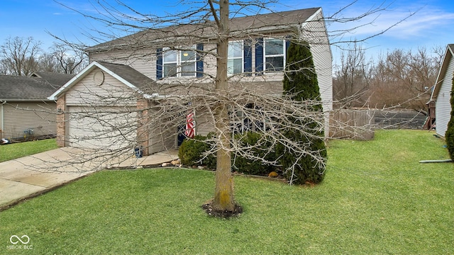 traditional-style home with a garage, concrete driveway, and a front lawn