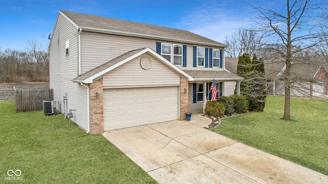 traditional-style house with an attached garage, brick siding, fence, concrete driveway, and a front yard