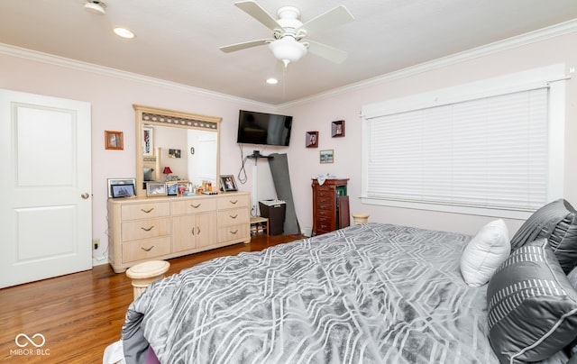 bedroom with dark wood-style floors, recessed lighting, and crown molding