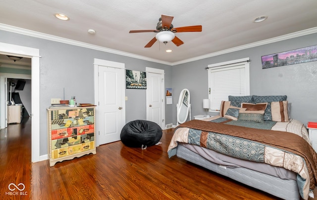 bedroom featuring recessed lighting, crown molding, baseboards, and wood finished floors