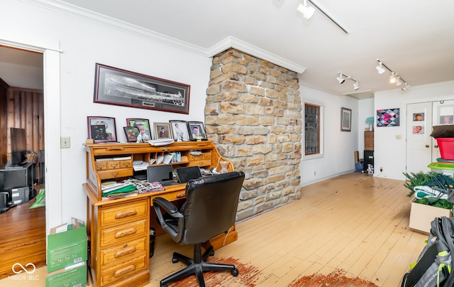 office featuring track lighting, crown molding, and wood finished floors