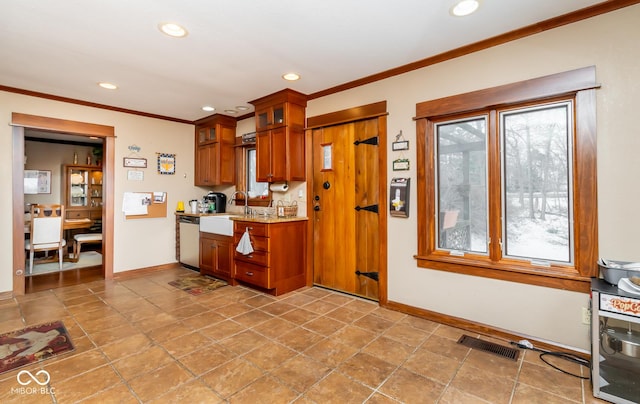 kitchen with glass insert cabinets, visible vents, dishwasher, and ornamental molding