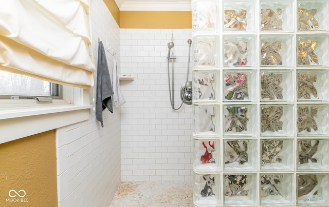 full bathroom featuring a walk in shower and crown molding