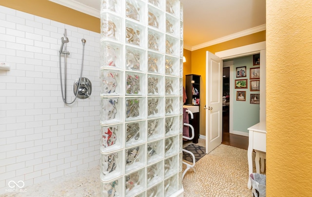 full bathroom with ornamental molding, baseboards, and walk in shower