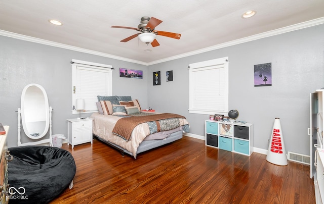 bedroom featuring crown molding, visible vents, baseboards, and dark wood-style flooring