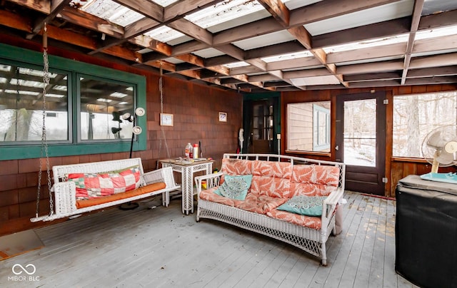 sunroom with coffered ceiling and beam ceiling