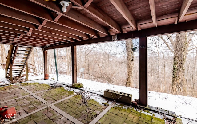 snow covered patio with stairs